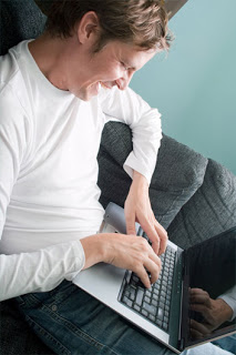 dreamstime_11523140-(smiling-man-having-fun-on-laptop-computer)